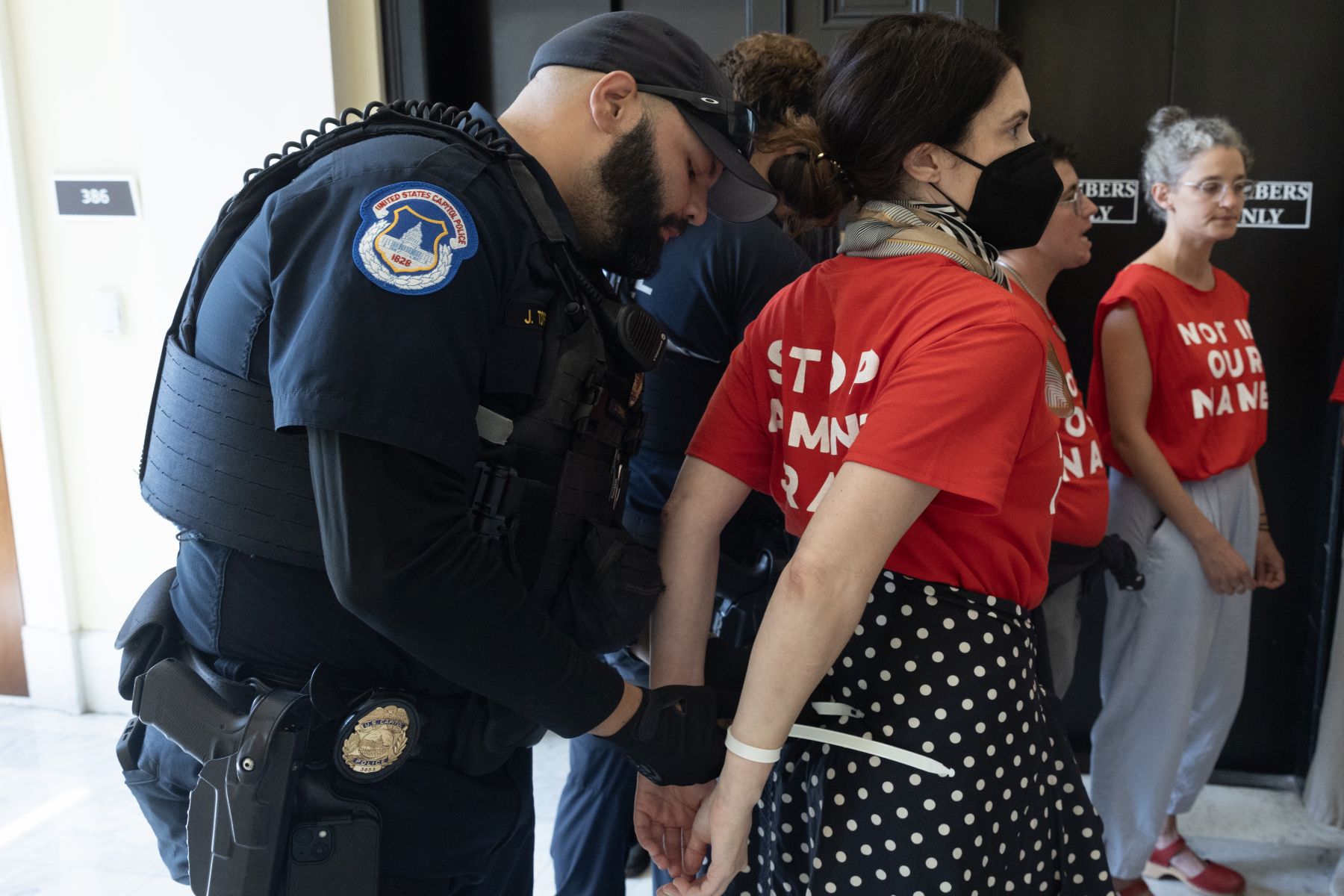 epa11493134 Pro-Palestinian demonstrators are removed by United States Capitol Police while protesting in the Cannon House Office Building on the eve of the visit of Prime Minister of Israel Benjamin Netanyahu, on Capitol Hill in Washington, DC, USA, 23 July 2024. Prime Minister of Israel Benjamin Netanyahu will address a joint meeting of the US Congress and large protests are expected.  EPA/MICHAEL REYNOLDS