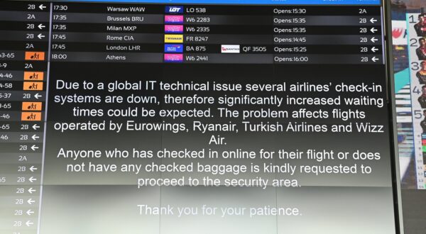 epa11487729 A message informs passengers in the departure hall at Liszt Ferenc International Airport in Budapest, Hungary, 19 July 2024, as companies and institutions around the world have been hit by a major global IT outage. At Budapest Airport, Eurowings, Ryanair, Turkish Airlines and Wizz Air flights have been affected due to disruptions to the passenger check-in system, causing flight delays and longer wait times. Several airlines have switched to manual passenger check-in at the airport. Companies and institutions around the world have been affected on 19 July by a major computer outage in systems running Microsoft Windows linked to a faulty CrowdStrike cyber-security software update. According to CrowdStrike’s CEO, the issue has been identified, isolated and a fix has been deployed.  EPA/ZOLTAN MATHE HUNGARY OUT
