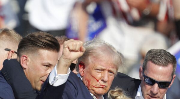 epa11476744 Former US President Donald Trump is rushed off stage by secret service after an incident during a campaign rally at the Butler Farm Show Inc. in Butler, Pennsylvania, USA, 13 July 2024.  EPA/DAVID MAXWELL