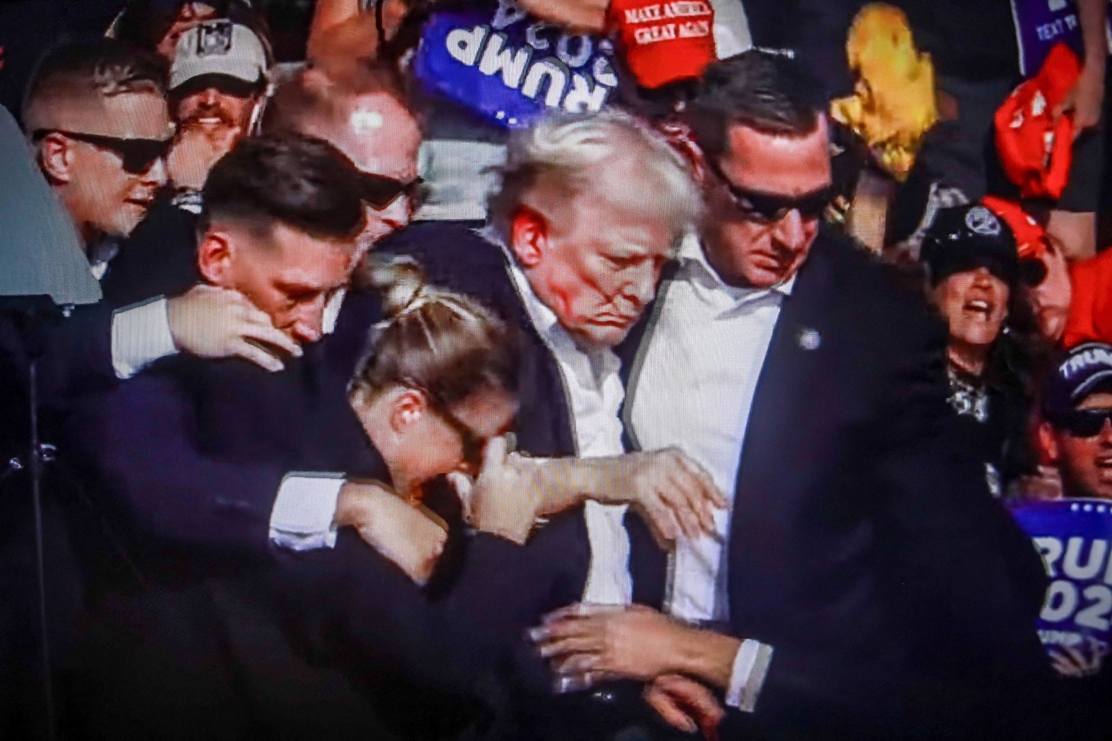 July 14, 2024, Butler, Pennsylvania, United States: In this photo illustration, a screen shows Former US President Donald Trump shot in the ear at a rally he was holding in Butler. Former US President Donald Trump was wounded in a shooting at a rally he was holding in Butler, Pennsylvania as part of his election campaign ahead of the 2024 US Presidential election. According to the latest reports, secret agents killed a shooter and one rally participant died at the hands of the shooter himself, the shooting at the rally is being investigated as an attempted assassination of former President Trump, the Associated Press reports, citing the Butler County District Attorney.
14 Jul 2024
Pictured: July 14, 2024, Butler, Pennsylvania, United States: In this photo illustration, a screen shows Former US President Donald Trump shot in the ear at a rally he was holding in Butler. Former US President Donald Trump was wounded in a shooting at a rally he was holding in Butler, Pennsylvania as part of his election campaign ahead of the 2024 US Presidential election. According to the latest reports, secret agents killed a shooter and one rally participant died at the hands of the shooter himself, the shooting at the rally is being investigated as an attempted assassination of former President Trump, the Associated Press reports, citing the Butler County District Attorney.,Image: 889593179, License: Rights-managed, Restrictions: NO Argentina, Australia, Bolivia, Brazil, Chile, Colombia, Finland, France, Georgia, Hungary, Japan, Mexico, Netherlands, New Zealand, Poland, Romania, Russia, South Africa, Uruguay, Model Release: no, Credit line: ZUMAPRESS.com / MEGA / The Mega Agency / Profimedia