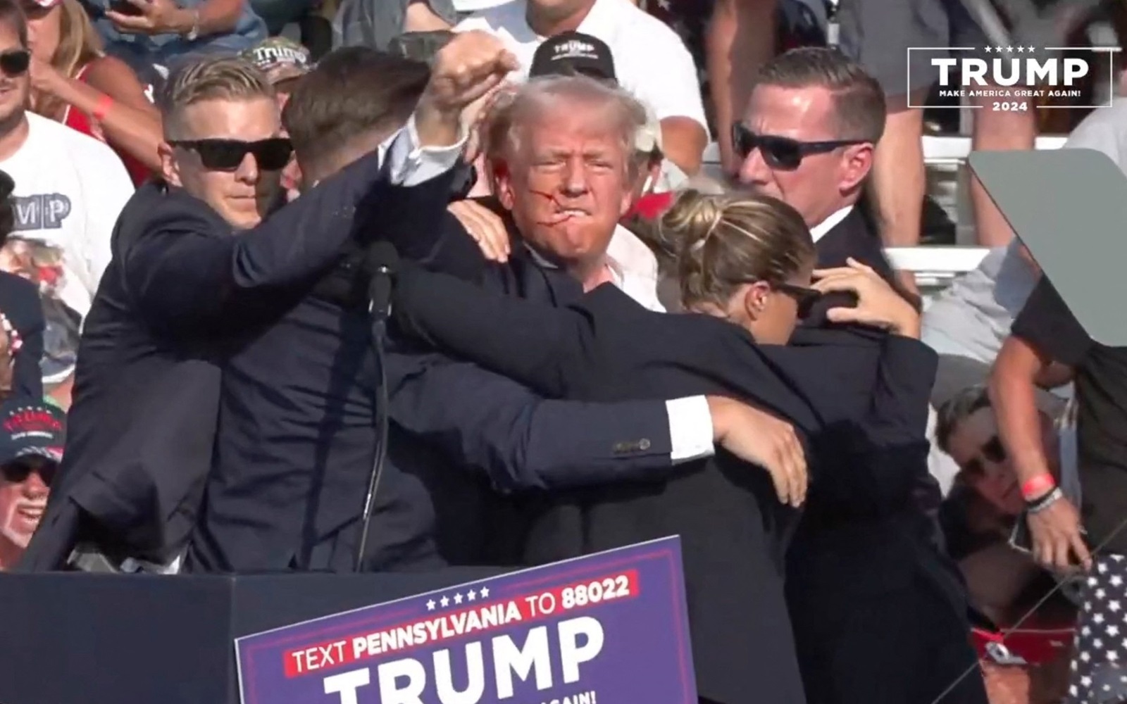 BUTLER, PENNSYLVANIA, UNITED STATES - JULY 13: (----EDITORIAL USE ONLY - MANDATORY CREDIT - 'TRUMP CAMPAIGN OFFICE / HANDOUT' - NO MARKETING NO ADVERTISING CAMPAIGNS - DISTRIBUTED AS A SERVICE TO CLIENTS----) A screen grab captured from a video shows Republican presidential candidate former President Donald Trump appears to be injured after gunshots were reported as he is rushed offstage during a rally on July 13, 2024 in Butler, Pennsylvania. Trump was seen bloodied on his right ear as he was being evacuated from the stage, according to social media footage. Trump Campaign Office / Handout / Anadolu,Image: 889558964, License: Rights-managed, Restrictions: ***
HANDOUT image or SOCIAL MEDIA IMAGE or FILMSTILL for EDITORIAL USE ONLY! * Please note: Fees charged by Profimedia are for the Profimedia's services only, and do not, nor are they intended to, convey to the user any ownership of Copyright or License in the material. Profimedia does not claim any ownership including but not limited to Copyright or License in the attached material. By publishing this material you (the user) expressly agree to indemnify and to hold Profimedia and its directors, shareholders and employees harmless from any loss, claims, damages, demands, expenses (including legal fees), or any causes of action or allegation against Profimedia arising out of or connected in any way with publication of the material. Profimedia does not claim any copyright or license in the attached materials. Any downloading fees charged by Profimedia are for Profimedia's services only. * Handling Fee Only 
***, Model Release: no, Credit line: Trump Campaign Office / Handout / AFP / Profimedia