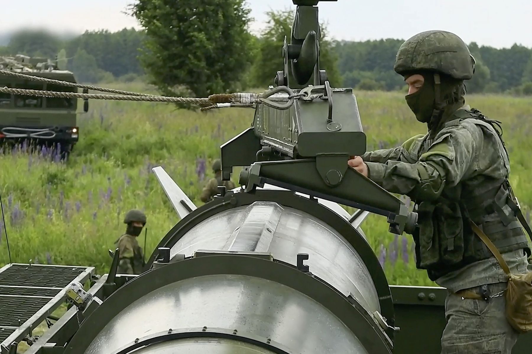 epa11407646 A still image taken from a handout video made available by the Russian Defence Ministry press-service shows Russian servicemen operating a non-strategic nuclear missile for Iskander operational-tactical missile system during the second stage of tactical nuclear drills of Russian and Belarus armed forces at an undisclosed location, 13 June 2024. In accordance with the decision of the President of the Russian Federation, the second stage of the exercise of non-strategic nuclear forces has begun. The exercises are aimed at maintaining the readiness of personnel and equipment of units for the combat use of non-strategic nuclear weapons of Russia and Belarus, the Russian Ministry of Defense said.  EPA/RUSSIAN DEFENCE MINISTRY PRESS S HANDOUT  HANDOUT EDITORIAL USE ONLY/NO SALES HANDOUT EDITORIAL USE ONLY/NO SALES