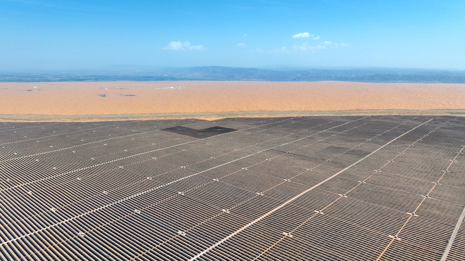 ZHONGWEI, CHINA - MAY 09: Aerial view of the second phase of China s largest renewable energy power base under construction at Tengger Desert on May 9, 2024 in Zhongwei, Ningxia Hui Autonomous Region of China. The project will provide about 3.96 billion kilowatt-hours of clean electricity annually after completion. Copyright: xVCGx 111495348206,Image: 871659941, License: Rights-managed, Restrictions: imago is entitled to issue a simple usage license at the time of provision. Personality and trademark rights as well as copyright laws regarding art-works shown must be observed. Commercial use at your own risk.;PUBLICATIONxNOTxINxCHN, Credit images as "Profimedia/ IMAGO", Model Release: no, Credit line: IMAGO / imago stock&people / Profimedia