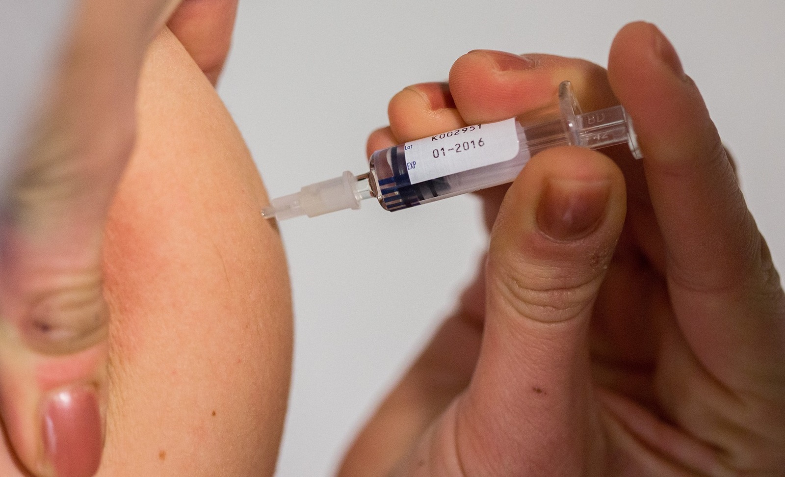 A man is given a given a measles vaccination in Berlin on February 23, 2015. A toddler has died of measles in the German capital, health authorities said, amid the country's worst outbreak in years and an intense debate about steps to boost vaccinations. The resurgence of the preventable disease in Germany, as well as in parts of the United States, coincides with a movement among some parents to refuse to vaccinate their children.,Image: 219812141, License: Rights-managed, Restrictions: GERMANY OUT, Model Release: no, Credit line: Lukas Schulze / AFP / Profimedia