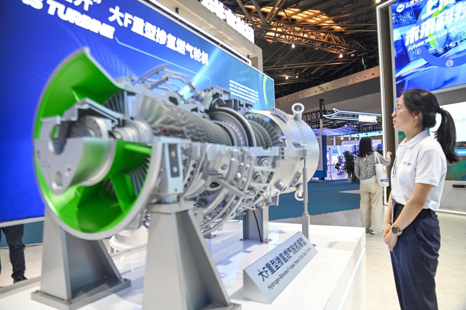 10th China Shanghai International Technology Fair Held in Shanghai SHANGHAI, CHINA - JUNE 13, 2024 - Visitors view a model exhibit of a heavy-duty hydrogen-doped gas turbine at The 10th China Shanghai International Technology Fair in Shanghai, China, June 13, 2024. Shanghai Shanghai China Copyright: xx i1718324631187,Image: 881540554, License: Rights-managed, Restrictions: imago is entitled to issue a simple usage license at the time of provision. Personality and trademark rights as well as copyright laws regarding art-works shown must be observed. Commercial use at your own risk.;PUBLICATIONxNOTxINxCHN, Credit images as "Profimedia/ IMAGO", Model Release: no, Credit line: CFOTO / imago stock&people / Profimedia