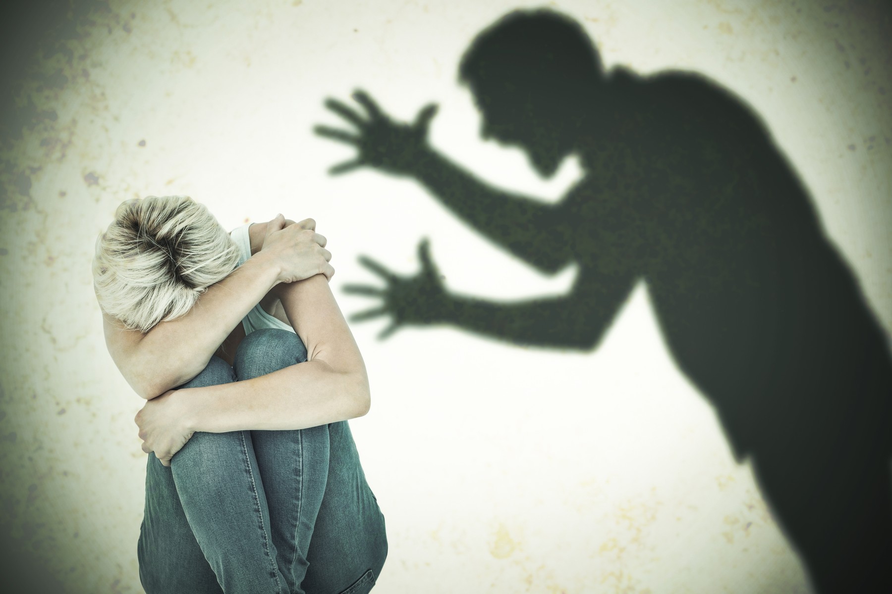 Depressed woman hiding her head  against silhouette of shouting man,Image: 267917909, License: Royalty-free, Restrictions: , Model Release: yes, Credit line: - / Wavebreak / Profimedia