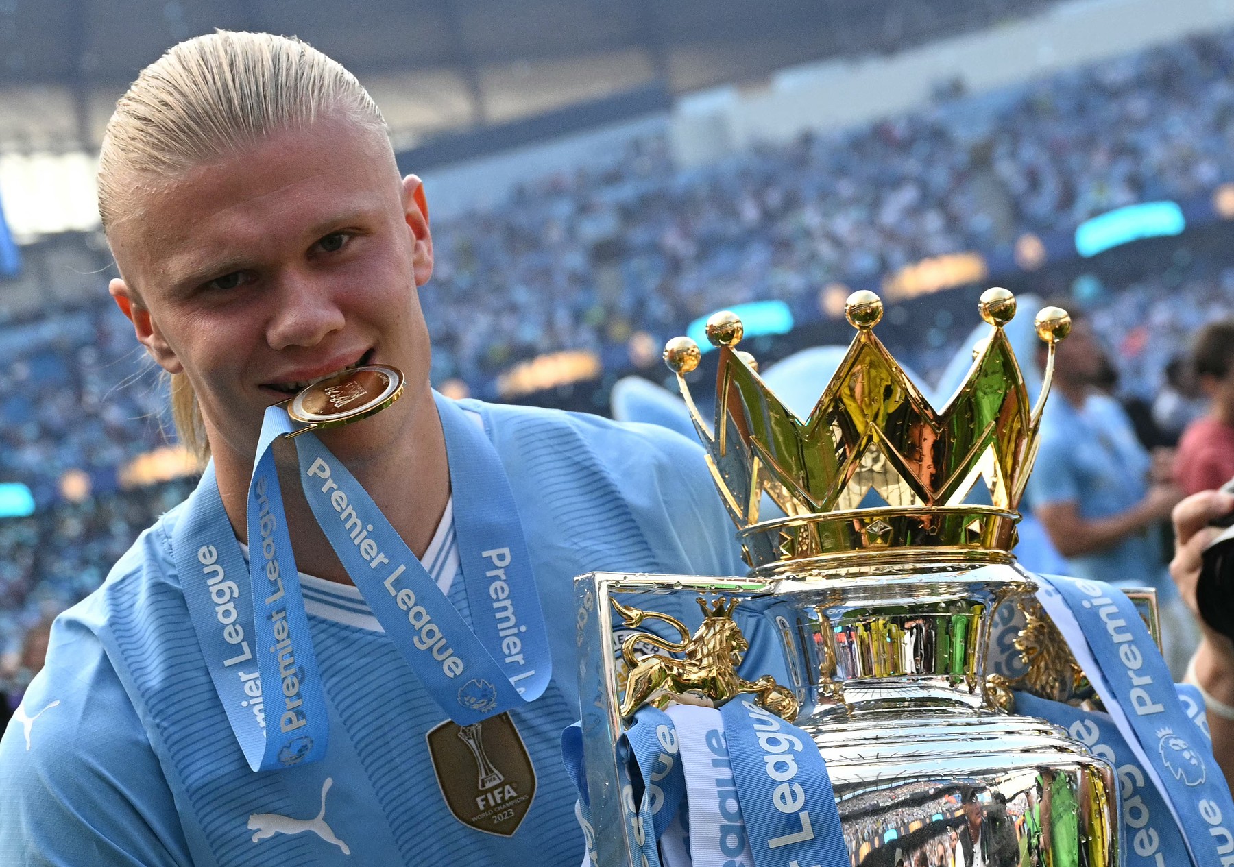 Manchester City's Norwegian striker #09 Erling Haaland poses with the Premier League trophy after the presentation ceremony following the English Premier League football match between Manchester City and West Ham United at the Etihad Stadium in Manchester, north west England, on May 19, 2024. Manchester City created English football history on Sunday, beating West Ham 3-1 to win an unprecedented fourth straight Premier League title.,Image: 874538388, License: Rights-managed, Restrictions: RESTRICTED TO EDITORIAL USE. No use with unauthorized audio, video, data, fixture lists, club/league logos or 'live' services. Online in-match use limited to 120 images. An additional 40 images may be used in extra time. No video emulation. Social media in-match use limited to 120 images. An additional 40 images may be used in extra time. No use in betting publications, games or single club/league/player publications., Model Release: no, Credit line: Oli SCARFF / AFP / Profimedia