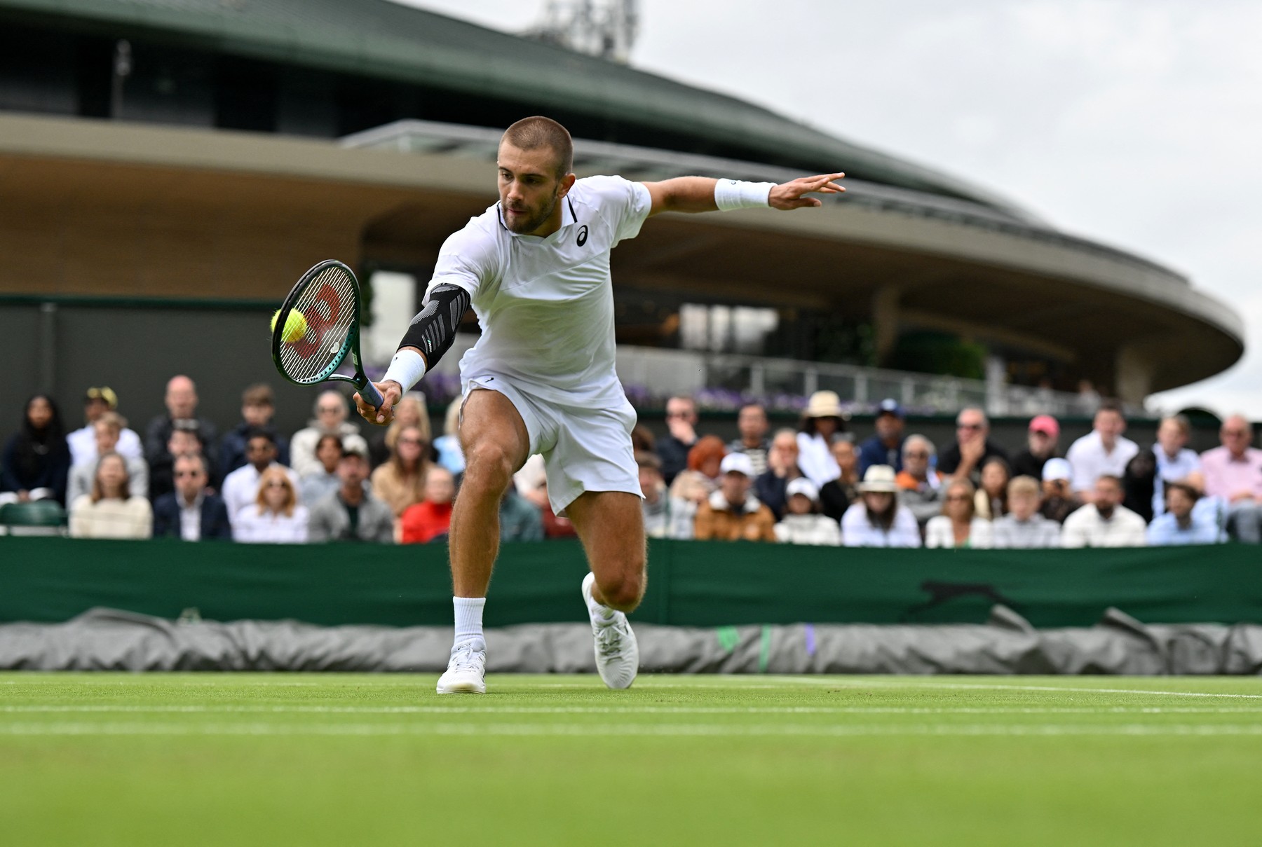 Croatia's Borna Coric returns against US player Frances Tiafoe during their men's singles second round tennis match on the third day of the 2024 Wimbledon Championships at The All England Lawn Tennis and Croquet Club in Wimbledon, southwest London, on July 3, 2024.,Image: 886957428, License: Rights-managed, Restrictions: RESTRICTED TO EDITORIAL USE, Model Release: no, Credit line: Glyn KIRK / AFP / Profimedia