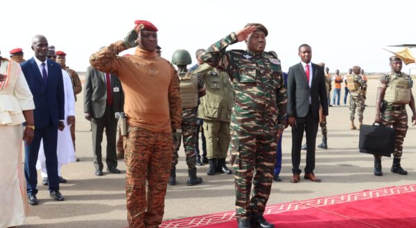 Niger's General Abdourahamane Tiani (R) salutes next to his Burkinabe counterpart Captain Ibrahim Traore (L) upon his arrival in Niamey on July 5, 2024. A divided West Africa  hosts two presidential summits this weekend -- one in Niger between Sahel region military regime leaders, followed by another in Nigeria on Sunday with leaders of a wider economic bloc. Saturday's summit in Niger's capital Niamey, will mark the first between the military leaders of a new regional bloc, the Alliance of Sahel States (AES). Mali, Burkina Faso and Niger set up the mutual defence pact in September, leaving the wider Economic Community of West African States (ECOWAS) bloc in January.,Image: 887665992, License: Rights-managed, Restrictions: , Model Release: no, Credit line: AFP / AFP / Profimedia