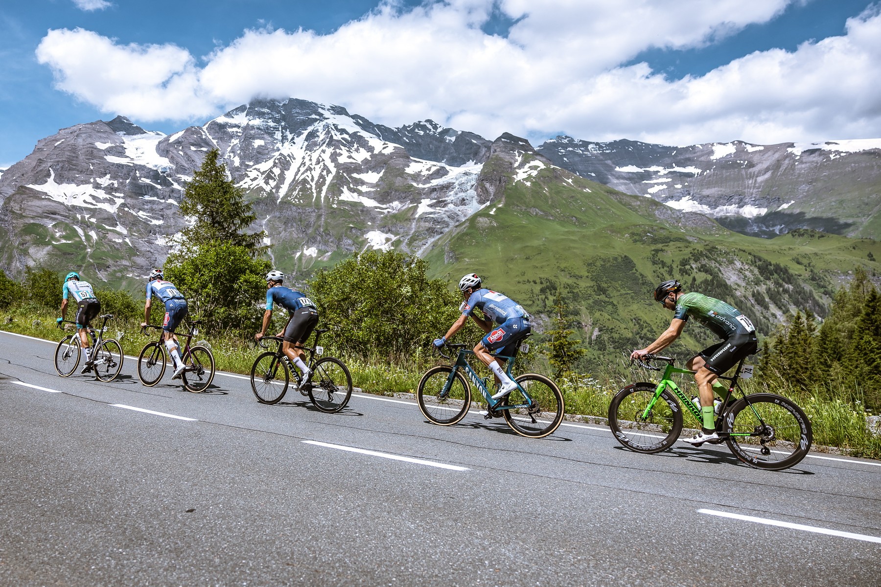 Cyclists (L-R) Italy's Samuele Zoccarato, Austria's Michael Gogl, Norway's Andre Drege, the Netherland's Oscar Riesebeek and Germany's Jonas Rapp ride in a partly snow-covered mountain area during the 4th stage from St. Johann Alpendorf to Kals am Großglockner (151,7 km) of the 2024 Tour of Austria on July 6, 2024.,Image: 887749771, License: Rights-managed, Restrictions: Austria OUT
SOUTH TYROL OUT, Model Release: no, Credit line: Johann GRODER / AFP / Profimedia