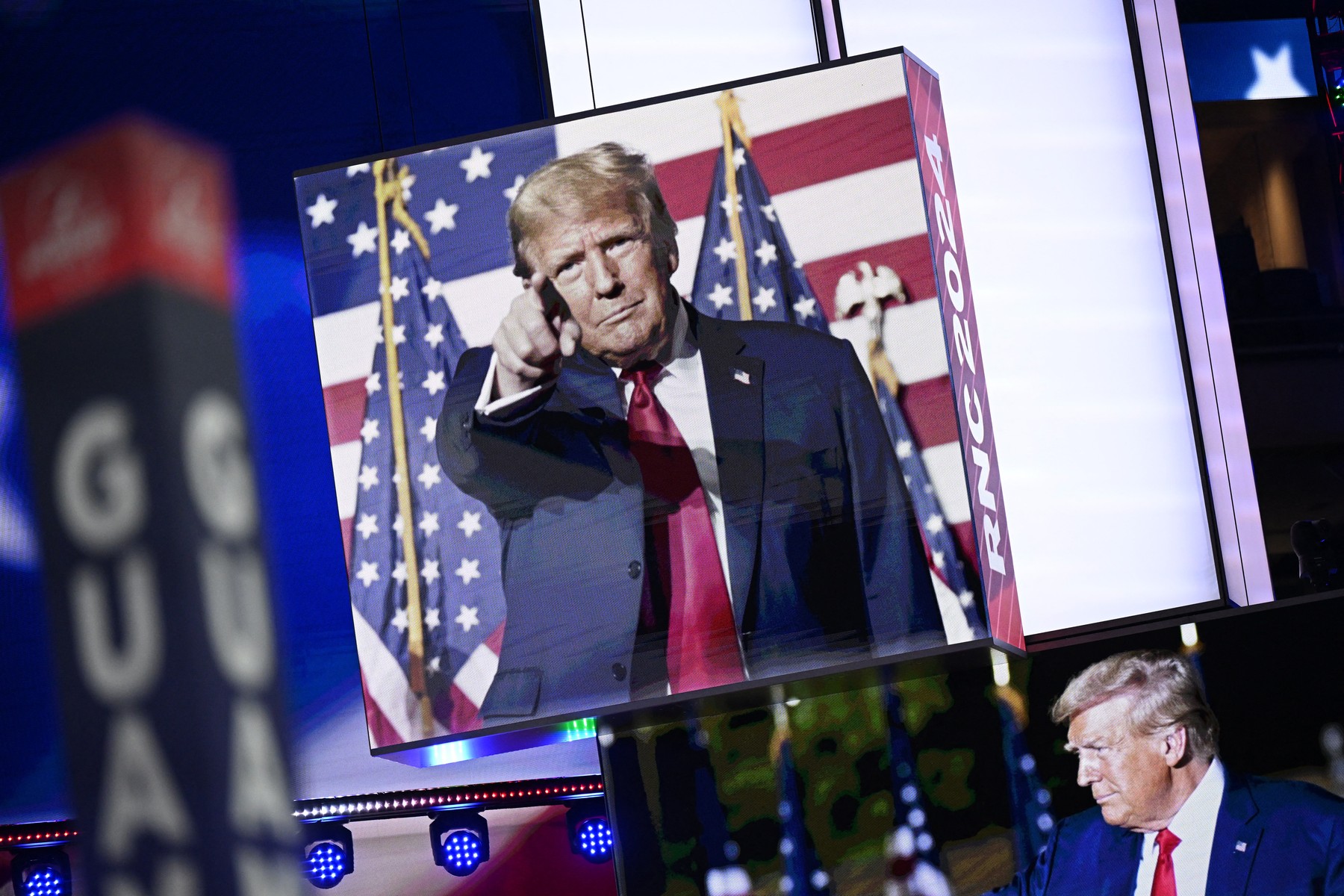 MILWAUKEE, WISCONSIN - JULY 14: Images of Donald Trump appear on stage screens in the Fiserv Forum on the day before the Republican National Convention (RNC) on July 14, 2024, in Milwaukee, Wisconsin. The RNC will be held in Milwaukee from July 15-18.   Leon Neal,Image: 889667042, License: Rights-managed, Restrictions: , Model Release: no, Credit line: LEON NEAL / Getty images / Profimedia