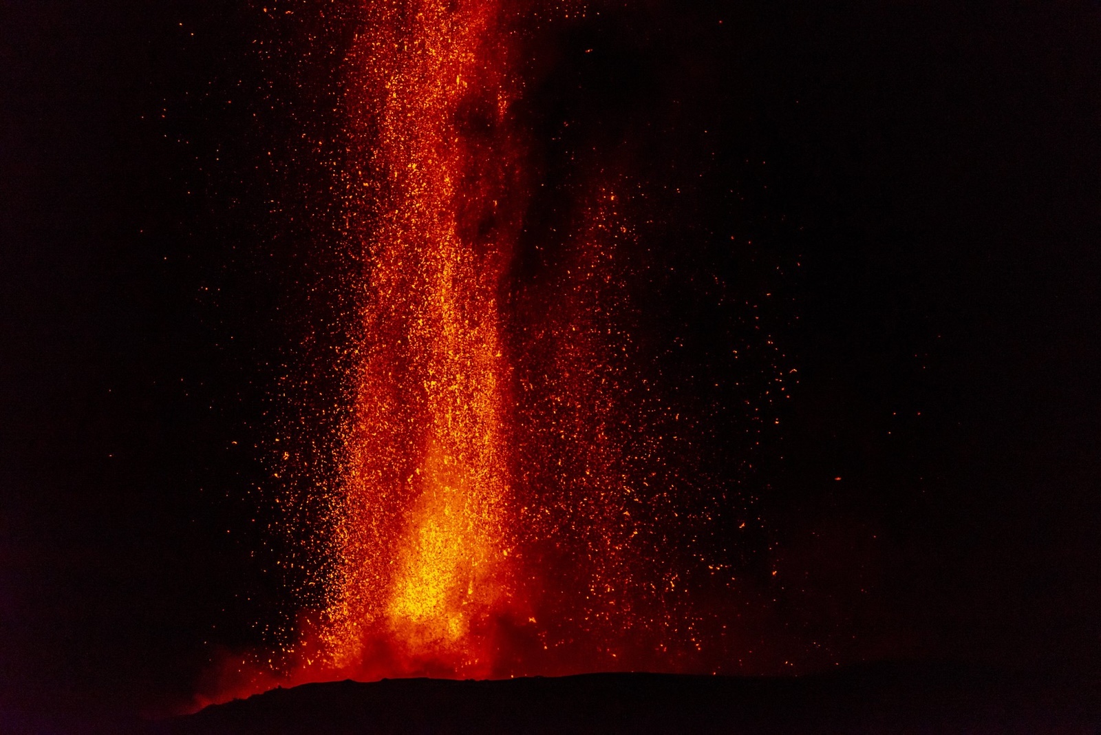 CATANIA, ITALY - JULY 16: A view of Mount Etna seen from Adrano, Catania producing a new eruption on July 16, 2024. From the late afternoon of 15 July until 03:00 on the night of 16 July, the activity was characterised by a lava fountain from the Voragine Crater that produced an eruptive column about 6000 m above sea level that propagated in an easterly direction with ash fallout in the towns of Viagrande and Acicastello until it was exhausted, a northwestern lava flow from the Bocca Nuova crater with the front at an altitude of about 3000 m above sea level. Salvatore Allegra / Anadolu/ABACAPRESS.COM