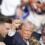 epa11476744 Former US President Donald Trump is rushed off stage by secret service after an incident during a campaign rally at the Butler Farm Show Inc. in Butler, Pennsylvania, USA, 13 July 2024.  EPA/DAVID MAXWELL