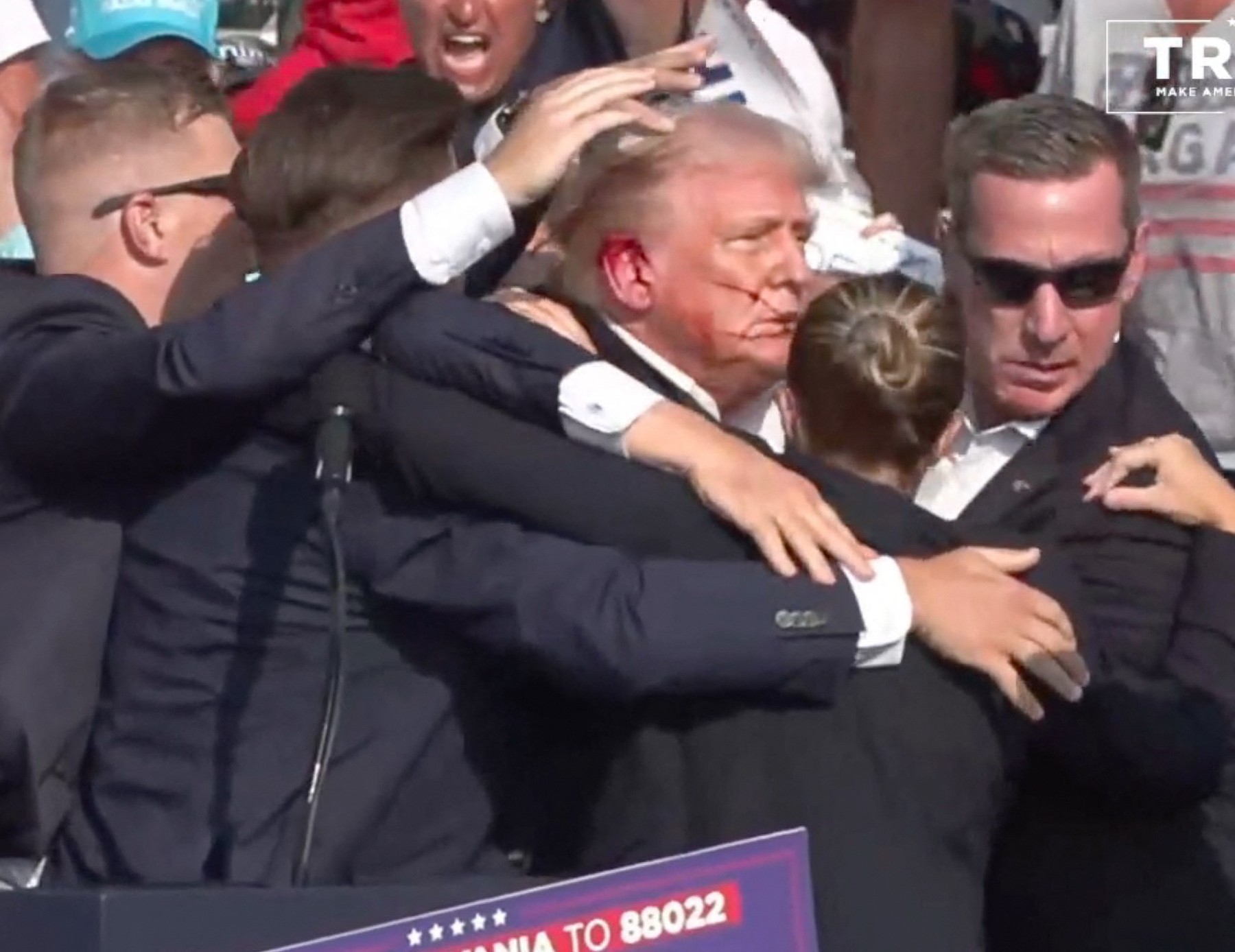 BUTLER, PENNSYLVANIA, UNITED STATES - JULY 13: (----EDITORIAL USE ONLY - MANDATORY CREDIT - 'TRUMP CAMPAIGN OFFICE / HANDOUT' - NO MARKETING NO ADVERTISING CAMPAIGNS - DISTRIBUTED AS A SERVICE TO CLIENTS----) A screen grab captured from a video shows Republican presidential candidate former President Donald Trump appears to be injured after gunshots were reported as he is rushed offstage during a rally on July 13, 2024 in Butler, Pennsylvania. Trump was seen bloodied on his right ear as he was being evacuated from the stage, according to social media footage. Trump Campaign Office / Handout / Anadolu/ABACAPRESS.COM,Image: 889559243, License: Rights-managed, Restrictions: ***
HANDOUT image or SOCIAL MEDIA IMAGE or FILMSTILL for EDITORIAL USE ONLY! * Please note: Fees charged by Profimedia are for the Profimedia's services only, and do not, nor are they intended to, convey to the user any ownership of Copyright or License in the material. Profimedia does not claim any ownership including but not limited to Copyright or License in the attached material. By publishing this material you (the user) expressly agree to indemnify and to hold Profimedia and its directors, shareholders and employees harmless from any loss, claims, damages, demands, expenses (including legal fees), or any causes of action or allegation against Profimedia arising out of or connected in any way with publication of the material. Profimedia does not claim any copyright or license in the attached materials. Any downloading fees charged by Profimedia are for Profimedia's services only. * Handling Fee Only 
***, Model Release: no, Credit line: AA/ABACA / Abaca Press / Profimedia