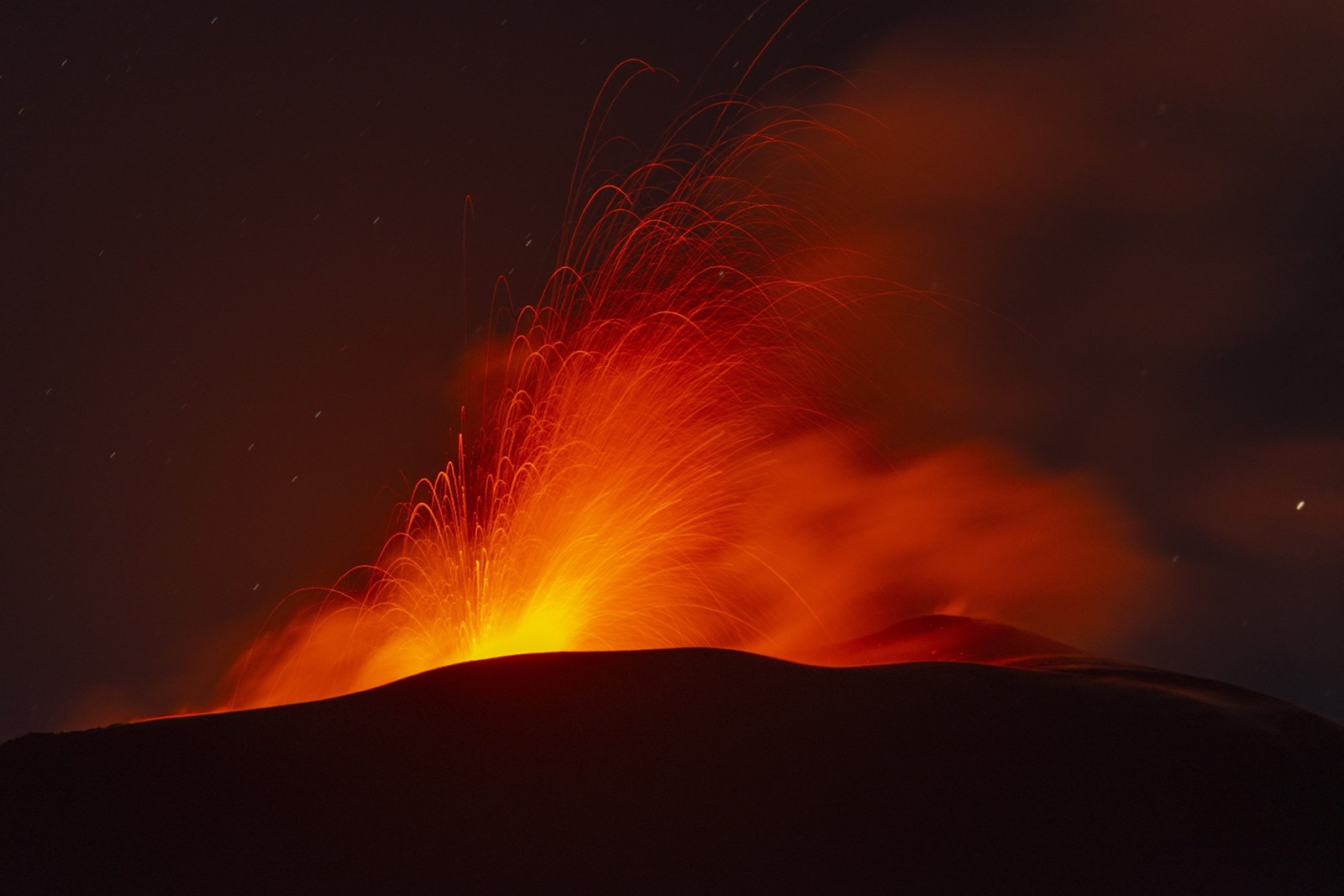 CATANIA, ITALY - JULY 23: A view of Etna volcano during spewed ash and lava strongly in Catania, Italy on July 23, 2024. In the evening of 22 July, strong strombolian activity started from Voragine Crater and continued with ups and downs throughout the night, culminating in a paroxysmal event at dawn that lasted until late morning on 23 July. The ash column reached a height of more than 8 km and, carried by the wind in a southerly direction, reached the city of Catania, where more than 1200 tonnes of volcanic ash have been removed in the last few days due to the recent eruptions; the ash reached Catania International Airport, forcing the suspension of air traffic, with many flights being diverted to other airports on the island or cancelled. Salvatore Allegra / Anadolu/ABACAPRESS.COM,Image: 891655725, License: Rights-managed, Restrictions: , Model Release: no, Credit line: AA/ABACA / Abaca Press / Profimedia