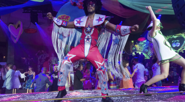 Two dancers at the Flower Power party at Pacha Ibiza nightclub, on June 7, 2022, in Ibiza, Balearic Islands (Spain). The Flower Power party has been held at the legendary Pacha Ibiza nightclub for four decades with a colorful proposal that perfectly captures the essence of the most hippie Ibiza. The event offers a soundtrack based on great classics of rock, soul, funk and pop of the 60's, 70's and 80's with a creative and colorful decoration. In addition, the audience usually dresses in bell-bottoms, flowers in their hair, wigs and colorful dresses. The party has been held every Monday since May 23, after the island's nightlife reopened after two years of inactivity due to the pandemic. FLOWER POWER;PACHA;DISCO Germán Lama / Europa Press 06/07/2022 (Europa Press via AP)