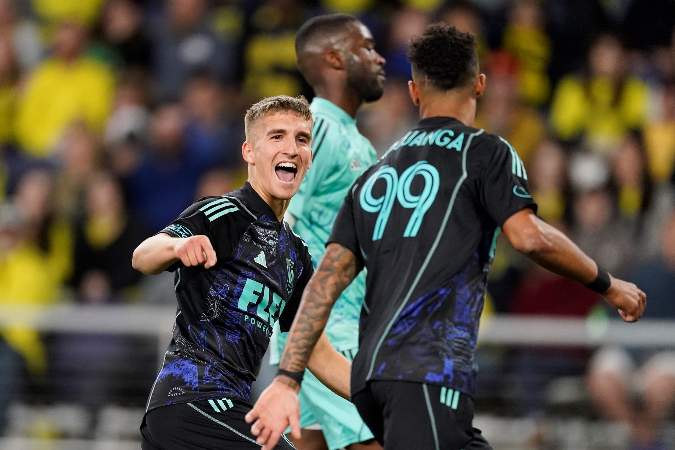 Los Angeles FC forward Stipe Biuk, centre, congratulates forward Denis Bouanga right, after his goal against the Nashville SC during the second half of an MLS 