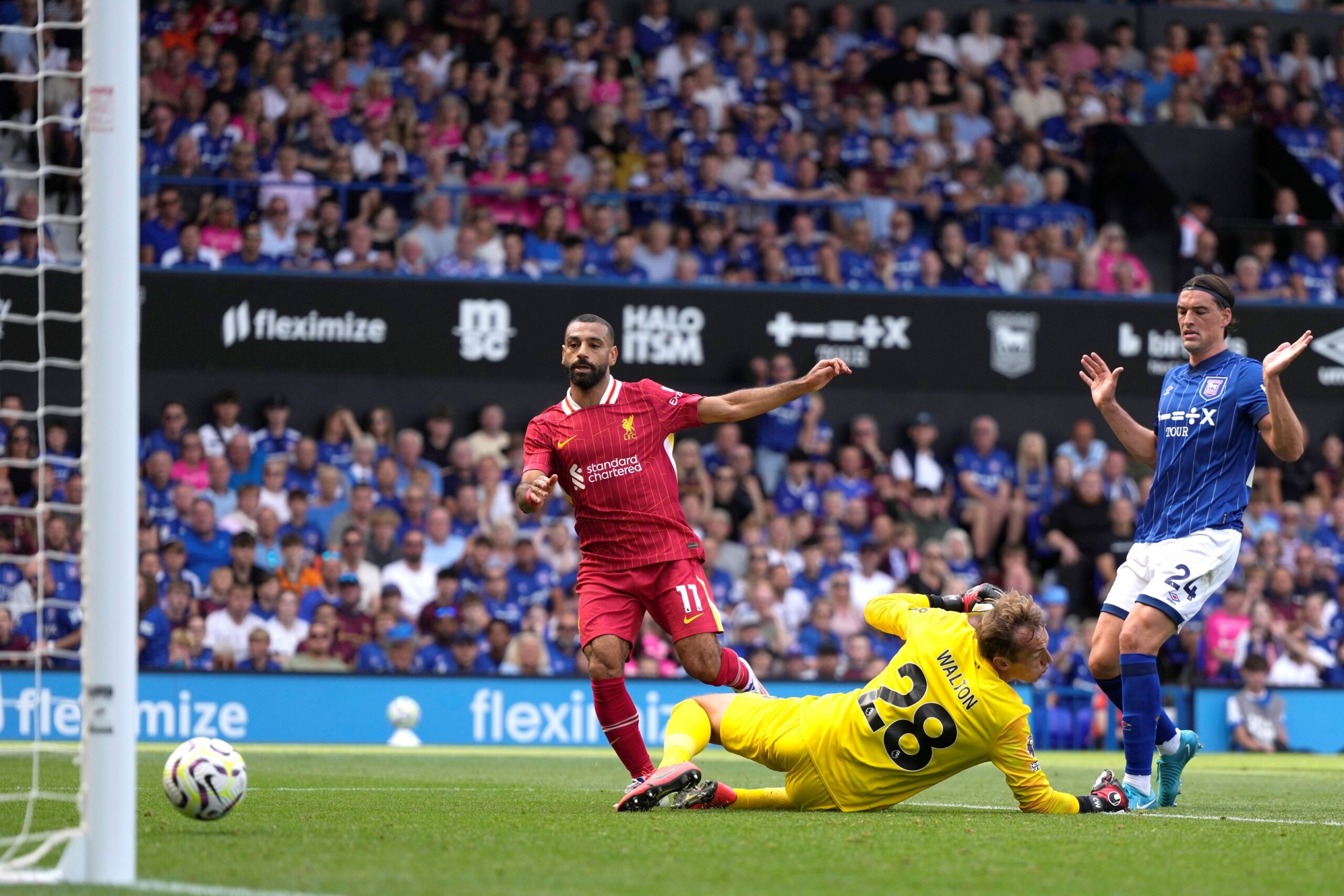 Liverpool's Mohamed Salah scores his side's second goal during the English Premier League soccer match between Ipswich Town and Liverpool at Portman Road stadium in Ipswich