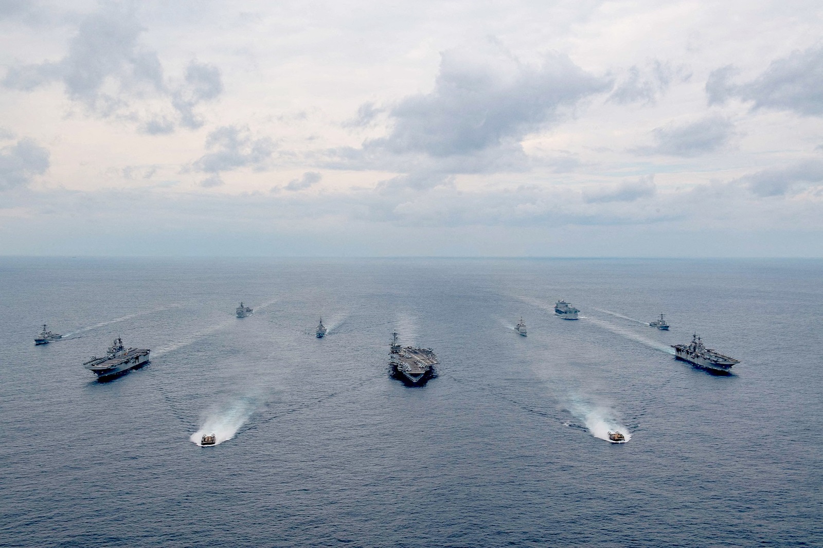 Handout photo dated February 7, 2022 of ships of the America and Essex Amphibious Ready Groups, and Carrier Strike Group (CSG) 3, sail in formation in the Philippine Sea with the Japan Maritime Self-Defense Force during exercise Noble Fusion. Front row: Landing craft, air cushion from Assault Craft Unit (ACU) 5. Second row, left to right: USS America (LHA 6), USS Abraham Lincoln (CVN 72), USS Essex (LHD 2). Third row, left to right: USS Dewey (DDG 105), JS Kongō (DDG 173), USS Mobile Bay (CG 53), USS Spruance (DDG 111). Back row, left to right: USS Ashland (LSD 48), USS Miguel Keith (ESB 5). TThe US is sending a carrier strike group, a fighter squadron and additional warships to the Middle East as the region braces for an Iranian retaliation to the killing of a senior Hamas leader in Tehran earlier this week. On Friday August 2, 2024, Defense Secretary Lloyd Austin ordered the USS Abraham Lincoln strike group to replace the USS Theodore Roosevelt strike group, which is currently operating in the Gulf of Oman, according to a statement from Pentagon deputy press secretary Sabrina Singh. U.S. Navy,Image: 895556296, License: Rights-managed, Restrictions: ***
HANDOUT image or SOCIAL MEDIA IMAGE or FILMSTILL for EDITORIAL USE ONLY! * Please note: Fees charged by Profimedia are for the Profimedia's services only, and do not, nor are they intended to, convey to the user any ownership of Copyright or License in the material. Profimedia does not claim any ownership including but not limited to Copyright or License in the attached material. By publishing this material you (the user) expressly agree to indemnify and to hold Profimedia and its directors, shareholders and employees harmless from any loss, claims, damages, demands, expenses (including legal fees), or any causes of action or allegation against Profimedia arising out of or connected in any way with publication of the material. Profimedia does not claim any copyright or license in the attached materials. Any downloading fees charged by Profimedia are for Profimedia's services only. * Handling Fee Only 
***, Model Release: no, Credit line: ABACA / Abaca Press / Profimedia