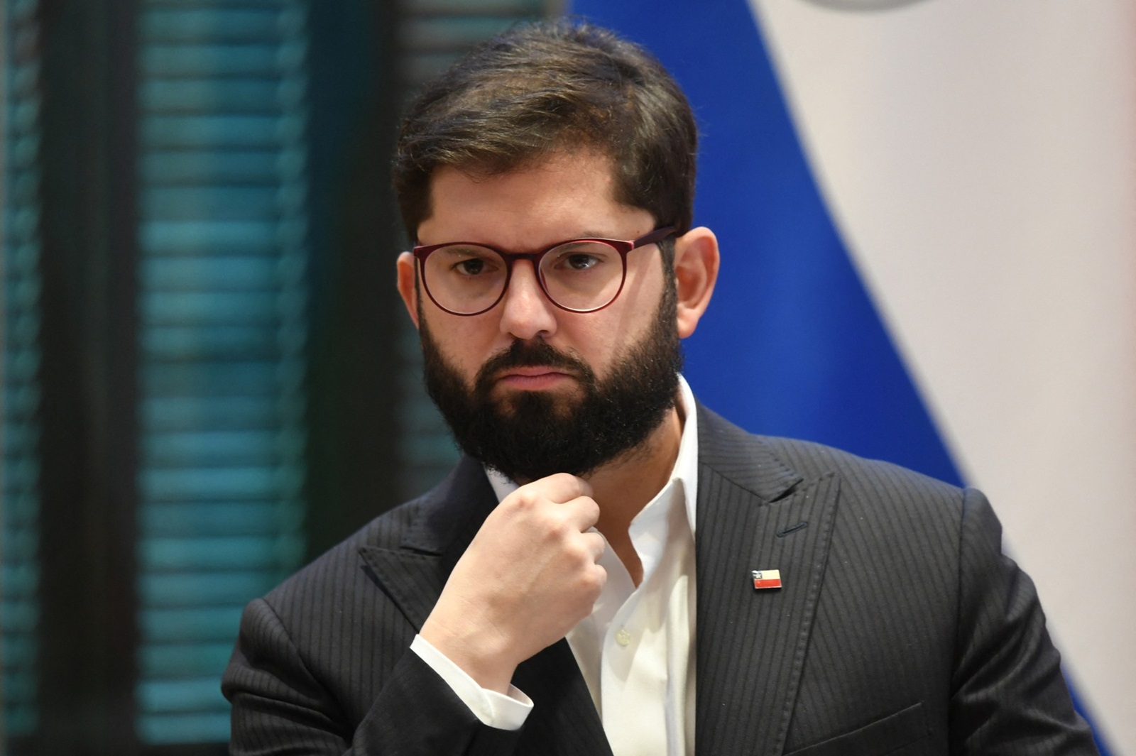 Chile's President Gabriel Boric listens to his Paraguayan counterpart Santiago Peña (out of frame) during a joint press conference at the Palacio de Lopez Presidential Palace in Asuncion on July 17, 2024. Boric is in the second day of his official visit to Paraguay.,Image: 890388191, License: Rights-managed, Restrictions: , Model Release: no, Credit line: DANIEL DUARTE / AFP / Profimedia