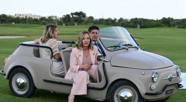 Italy's Prime Minister Giorgia Meloni (C) arrives on a small car to attend a flags ceremony at Borgo Egnazia Golf Club San Domenico during the G7 Summit hosted by Italy in Apulia region, on June 13, 2024 in Savelletri.  Leaders of the G7 wealthy nations gather in southern Italy this week against the backdrop of global and political turmoil, with boosting support for Ukraine top of the agenda.,Image: 881391999, License: Rights-managed, Restrictions: , Model Release: no, Credit line: Tiziana FABI / AFP / Profimedia