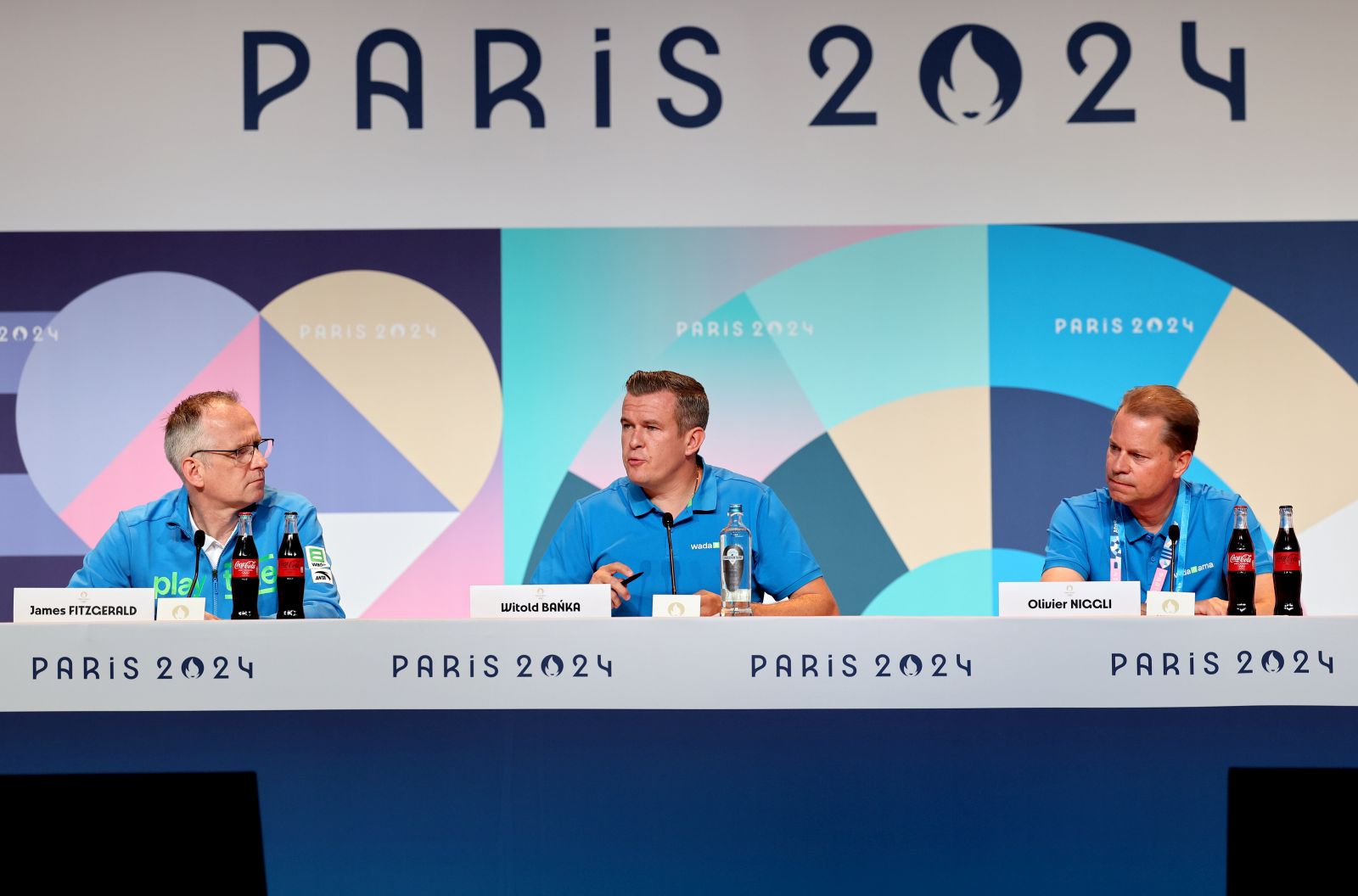 epa11495397 Witold Banka (C), president of the World Anti-Doping Agency (WADA) speaks during a press conference at the main press centre at the Paris 2024 Olympic Games, at the Trocadero in Paris, France, 25 July 2024. Left is James Fitzgerald, Head of Media Relations of WADA and right Olivier Niggli, Director General of WADA.  EPA/RITCHIE B. TONGO