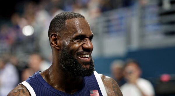 epa11503723 Lebron James of USA reacts after the Men Basketball Group C match between Serbia and USA in the Paris 2024 Olympic Games, at the Pierre Mauroy Stadium in Villeneuve-d'Ascq, France, 28 July 2024.  EPA/ALEX PLAVEVSKI