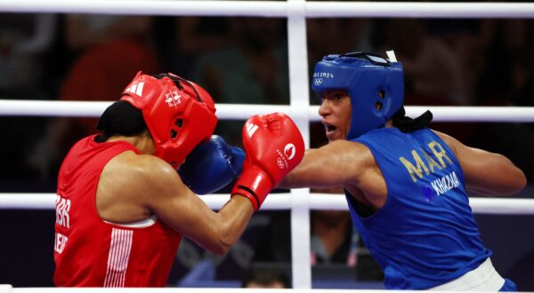 epa11511783 Chantelle Jordan Reid of Great Britain (red) and Khadija Mardi of Morocco (blue) in action during their Women's 75kg round of 16 bout of the Boxing competitions in the Paris 2024 Olympic Games, at the North Paris Arena in Villepinte, France, 31 July 2024.  EPA/DIVYAKANT SOLANKI