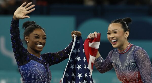 epa11516774 Simone Biles (L) and Sunisa Lee (R) of the US celebrate after the Women All-Around Final of the Artistic Gymnastics competitions in the Paris 2024 Olympic Games, at the Bercy Arena in Paris, France, 01 August 2024.  EPA/RITCHIE B. TONGO