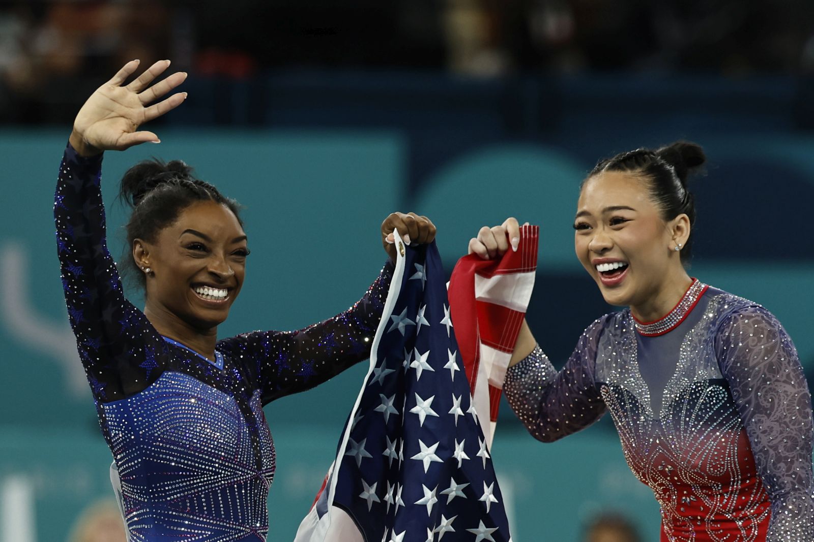 epa11516774 Simone Biles (L) and Sunisa Lee (R) of the US celebrate after the Women All-Around Final of the Artistic Gymnastics competitions in the Paris 2024 Olympic Games, at the Bercy Arena in Paris, France, 01 August 2024.  EPA/RITCHIE B. TONGO