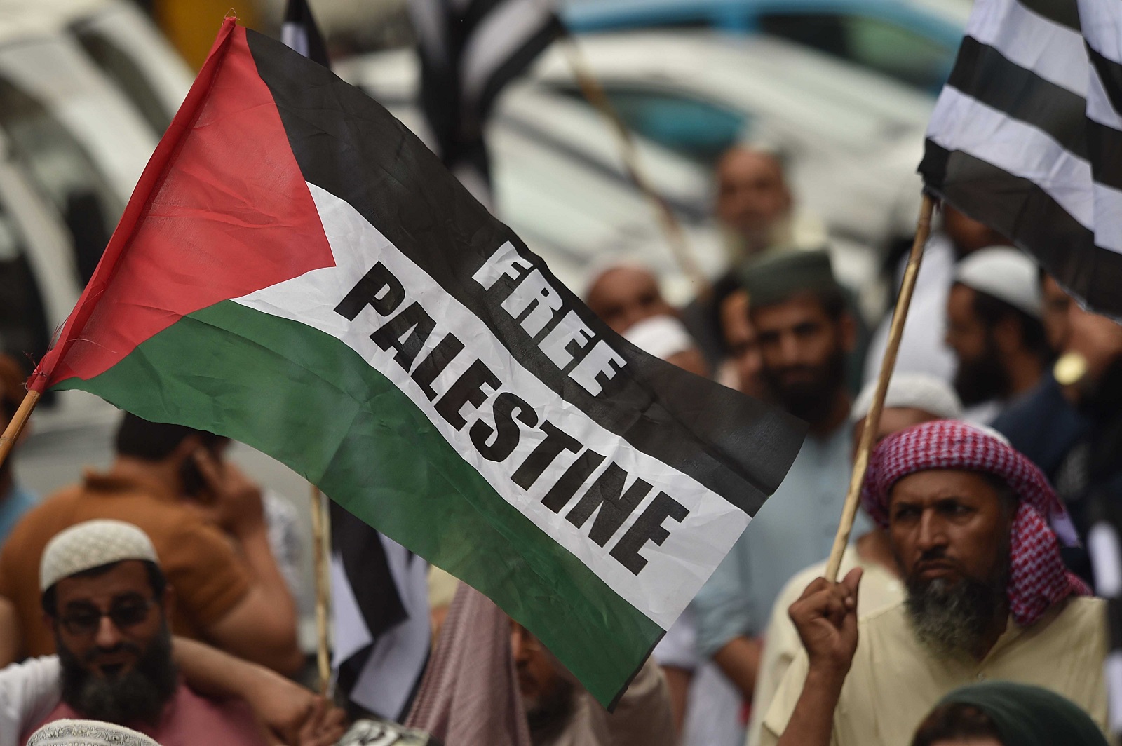 epa11519313 Supporters of the Islamic political party Jamiat Ulema-e-Islam (JUI-F) hold Palestinian flags as they attend a protest in solidarity with the Palestinian people, during a day of national mourning over the killing of Hamas political leader Ismail Haniyeh, in Karachi, Pakistan, 02 August 2024. Pakistan on 02 August observes a day of national mourning over the killing of Hamas political leader Ismail Haniyeh. Haniyeh and one of his bodyguards were targeted and killed in Tehran, Iran, on 31 July 2024, the Iranian Revolutionary Guard Corps (IRGC) confirmed. Hamas leader Haniyeh's funeral ceremony will be held in Qatar's capital Doha on 02 August 2024.  EPA/SHAHZAIB AKBER