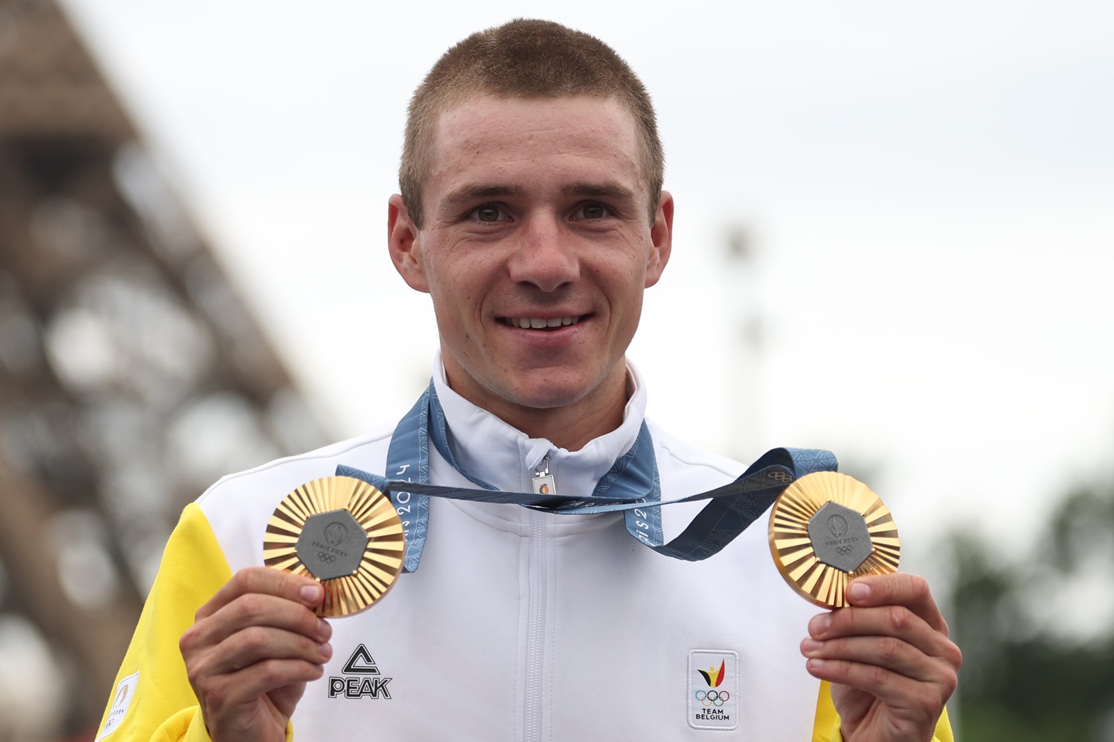 epa11522939 Remco Evenepoel of Belgium poses with his gold medals after the medal ceremony for the Men's Road Cycling Race of the Paris 2024 Olympic Games in Paris, France, 03 August 2024.  EPA/CHRISTOPHE PETIT TESSON