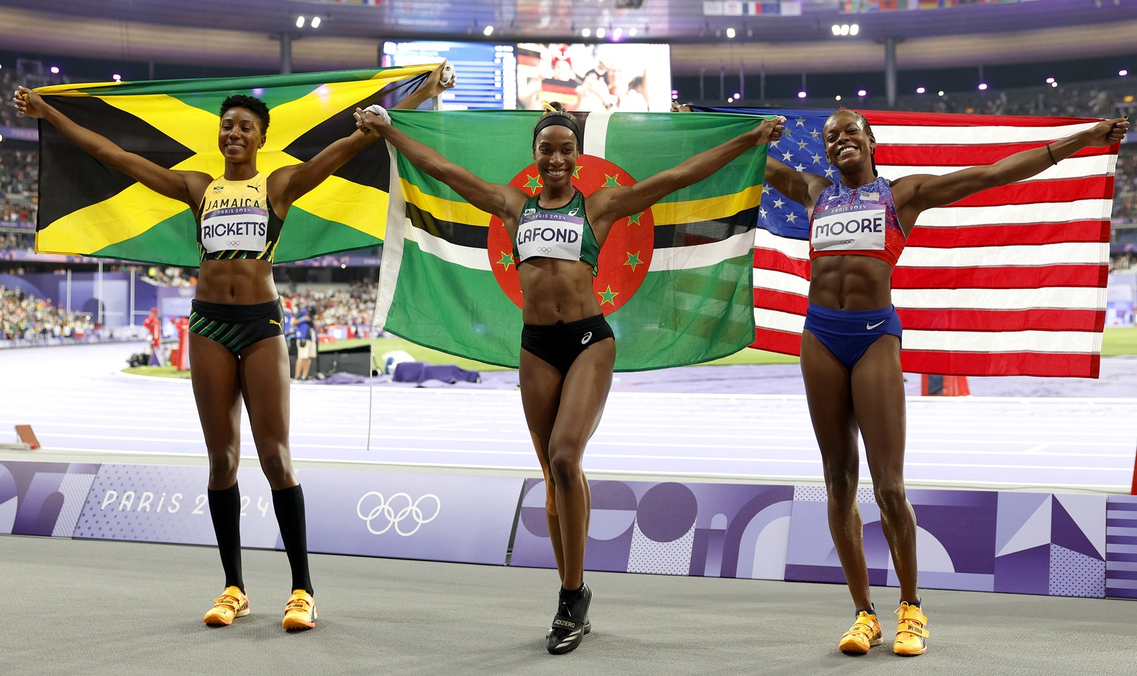 epa11523638 (from L) Second placed Shanieka Ricketts of Jamaica, winner Thea Lafond of Dominica and third placed Jasmine Moore of the usa celebrate after the Women Triple Jump final of the Athletics competitions in the Paris 2024 Olympic Games, at the Stade de France stadium in Saint Denis, France, 03 August 2024.  EPA/FRANCK ROBICHON