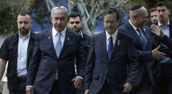 epa11526325 Israeli Prime Minister Benjamin Netanyahu (C-L) walks next to President Isaac Herzog (C-R) at the state memorial for former Revisionist Zionist leader and author Ze'ev Jabotinsky at Mount Herzl Military Cemetery in Jerusalem, 04 August 2024. Jabotinsky died on 03 August 1940.  EPA/Naama Grynbaum / POOL