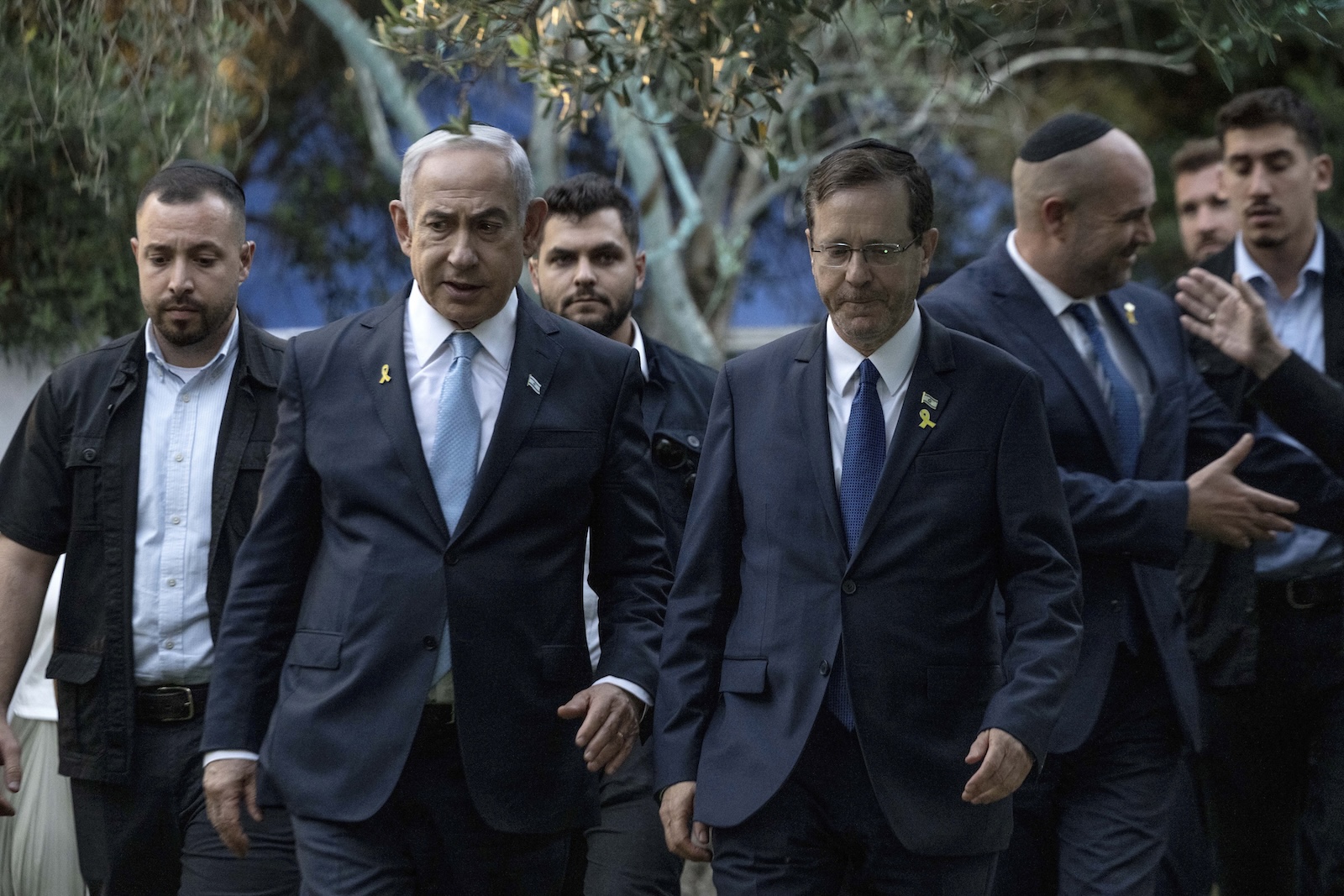 epa11526325 Israeli Prime Minister Benjamin Netanyahu (C-L) walks next to President Isaac Herzog (C-R) at the state memorial for former Revisionist Zionist leader and author Ze'ev Jabotinsky at Mount Herzl Military Cemetery in Jerusalem, 04 August 2024. Jabotinsky died on 03 August 1940.  EPA/Naama Grynbaum / POOL