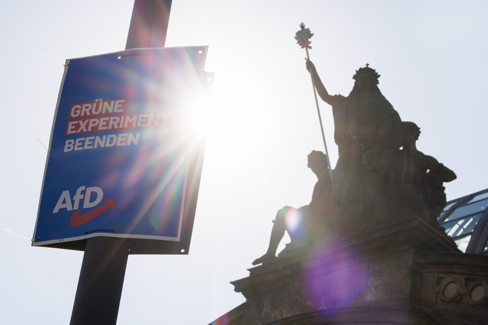 epa11547866 A campaigning poster of the far-right Alternative for Germany (AfD) party, reading 'end Green experiments' hangs on a light post in front of the railway station in Dresden, Germany, 13 August 2024. Saxony state election, voting for the regional parliament 'Landtag', will be held on 01 September 2024.  EPA/CLEMENS BILAN