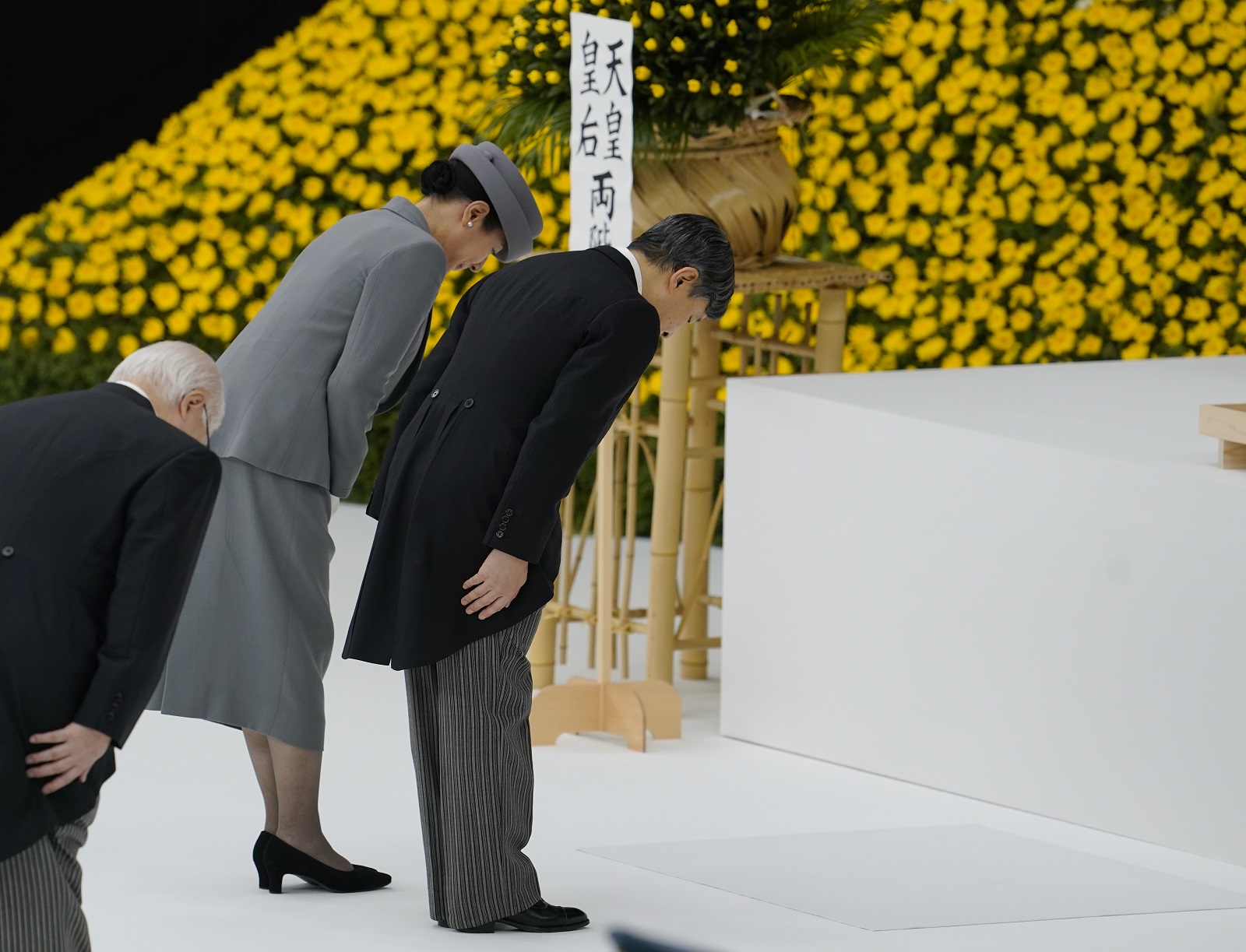 epa11549416 Japanese Emperor Naruhito and Empress Masako bow after giving a condolence speech during the National Memorial Ceremony for the War Dead in Tokyo, Japan, 15 August 2024. Japan marked the 79th anniversary of the end of World War Two, with an estimated more than three million Japanese being killed during its duration.  EPA/KIMIMASA MAYAMA