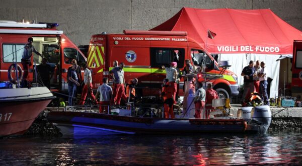 epa11556992 Rescue workers and divers from the Italian fire brigade work as a rescue operation continues for the missing people who were on board a sailboat that sank, in Porticello, Sicily Island, Italy, 20 August 2024. At least one person died, six remain missing and 15 passengers were rescued, after a 56-meter-long luxury sailboat, the Bayesian, with 22 people on board, sank on 19 August off Porticello, near Palermo, after a tornado hit the area. The six missing people have not yet been identified as dive teams are trying to find access into the yacht's cabins, sitting at 50 m below the surface of the water.  EPA/IGOR PETYX