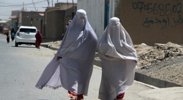 epa11560358 Burqa-clad Afghan women walk on a road in Kandahar, Afghanistan, 22 August 2024. The Taliban in Afghanistan have enforced new laws mandating that women must cover their bodies and faces in public, citing these measures as necessary to promote virtue and prevent vice, the Ministry for the Propagation of Virtue and Prevention of Vice said. Approved by their Supreme Leader Hibatullah Akhundzada, the regulations include restrictions on women's voices in public, the prohibition of images of living beings, and bans on music and mixed-gender interactions. The measures have drawn criticism from the United Nations (UN) for fostering fear and intimidation, especially among women and girls, as the Taliban's Ministry for the Propagation of Virtue and Prevention of Vice expands its control over public life.  EPA/QUDRATULLAH RAZWAN