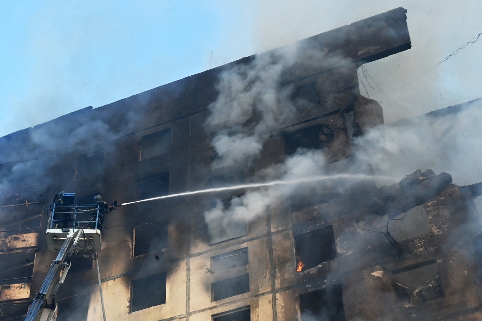 Ukrainian rescuers work to extinguish a fire in a residential building following a missile attack in Kharkiv on August 30, 2024. Russian strikes killed at least six people in the eastern Ukrainian city of Kharkiv, including a 14-year-old girl at a playground, and wounded dozens more, officials said on August 30, 2024.,Image: 903240601, License: Rights-managed, Restrictions: , Model Release: no, Credit line: SERGEY BOBOK / AFP / Profimedia