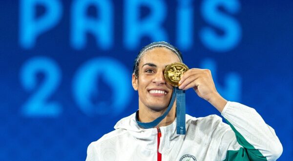 PARIS, FRANCE - AUGUST 09: Imane Khelif of Team Algeria celebrates as she wins gold medal after defeating Liu Yang (blue) of China in the Boxing Women's 66kg Final match on day fourteen of the Olympic Games Paris 2024 at Roland Garros on August 09, 2024 in Paris, France. Aytac Unal / Anadolu/ABACAPRESS.COM,Image: 897490219, License: Rights-managed, Restrictions: , Model Release: no, Credit line: AA/ABACA / Abaca Press / Profimedia