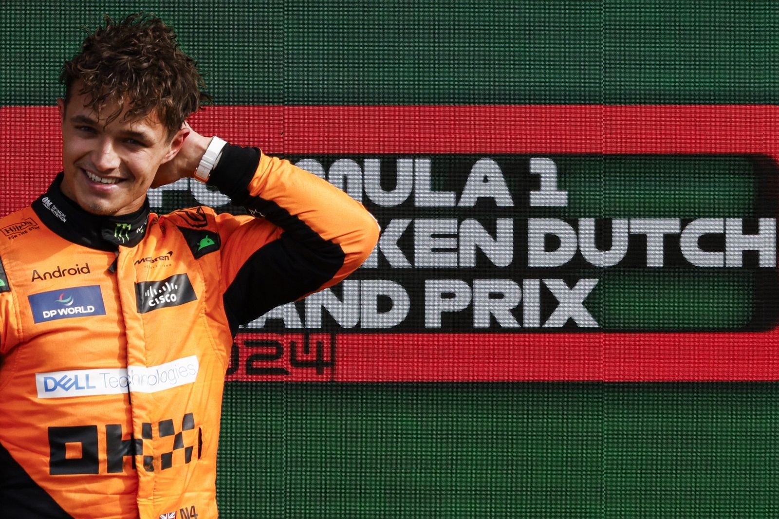 Winner McLaren's British driver Lando Norris celebrates during the podium ceremony after the Formula One Dutch Grand Prix at The Circuit Zandvoort, western Netherlands, on August 25, 2024.,Image: 901454031, License: Rights-managed, Restrictions: , Model Release: no, Credit line: SIMON WOHLFAHRT / AFP / Profimedia