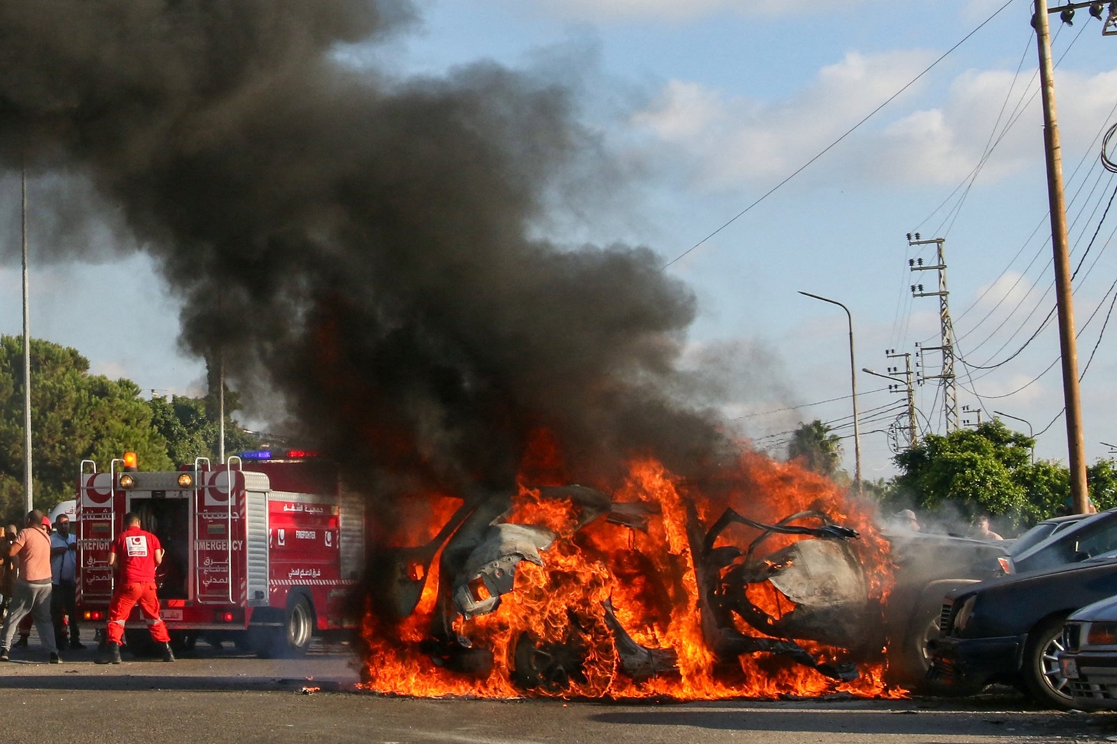 Firefighter arrive as a car burns following an Israeli strike in the southern Lebanese city of Sidon on August 9, 2024. A Lebanese security source said the Israeli strike on a vehicle in the southern city of Sidon killed a Hamas security official from the nearby Ain al-Helweh Palestinian refugee camp.,Image: 897393473, License: Rights-managed, Restrictions: , Model Release: no, Credit line: Mahmoud ZAYYAT / AFP / Profimedia