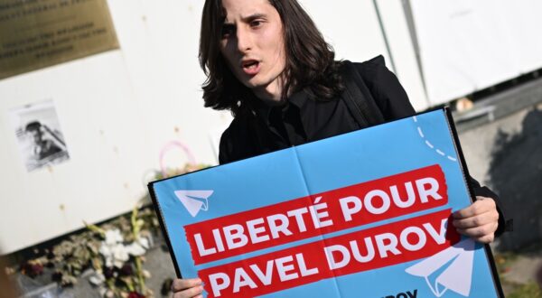 8749843 25.08.2024 A young man attends a rally in support of Telegram founder Pavel Durov near the French embassy in Moscow, Russia. On Saturday, Durov, who has dual Russian-French citizenship, was detained at Le Bourget airport outside Paris, France. The 39-year-old Russian-born is expected to appear before a judge on Sunday on charges linked to criminal uses of his social media app, including terrorism, drug trafficking and money laundering, which could land him in jail for up to 20 years.,Image: 901449589, License: Rights-managed, Restrictions: Editors' note: THIS IMAGE IS PROVIDED BY RUSSIAN STATE-OWNED AGENCY SPUTNIK., Model Release: no, Credit line: Alexey Maishev / Sputnik / Profimedia