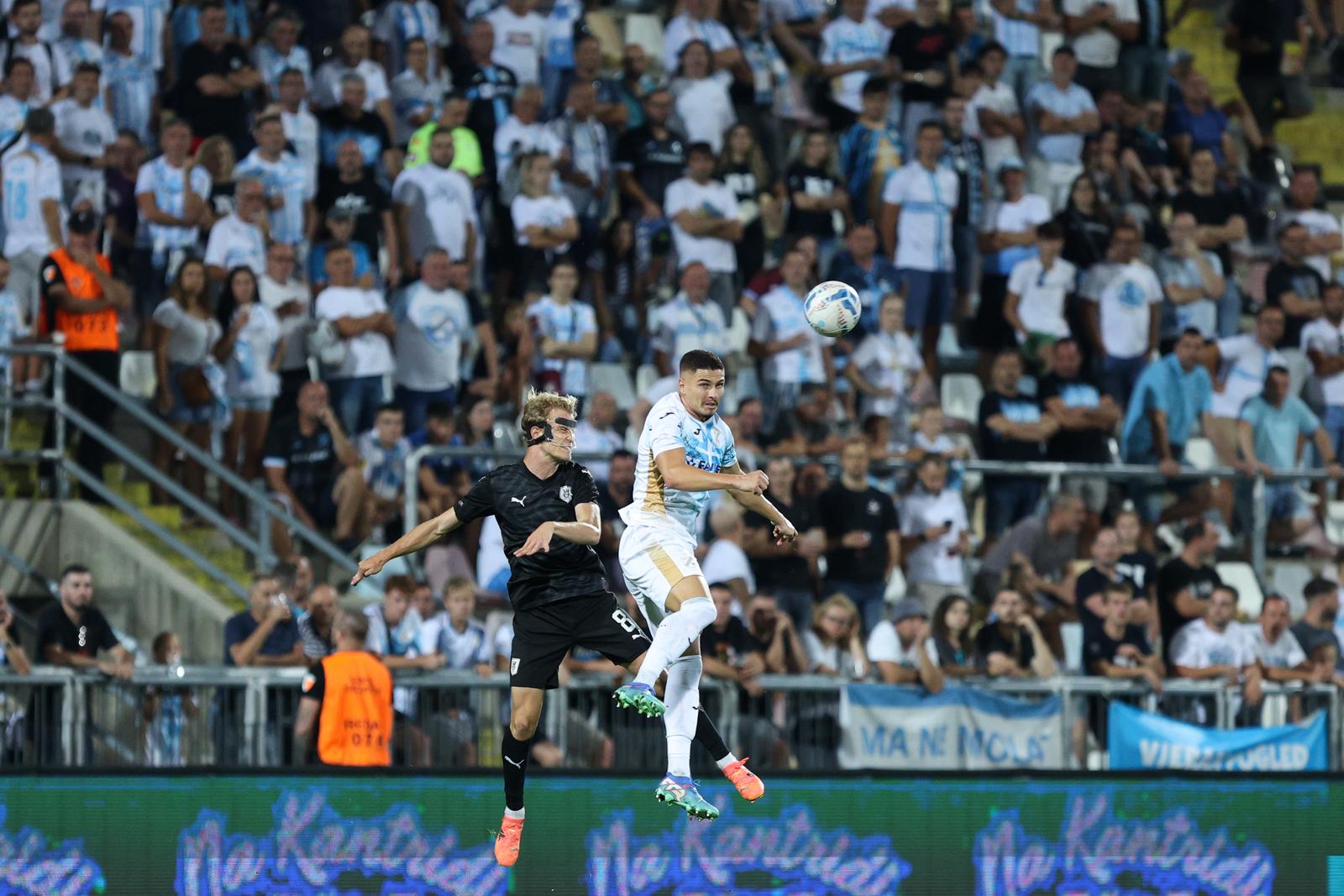 22.08.2024., stadion HNK Rijeka, Rijeka - Prva utakmica play-offa za ulazak u UEFA Konferencijsku ligu, HNK Rijeka - NK Olimpija. Justas Lasickas, Franjo Ivanovic Photo: Nel Pavletic/PIXSELL