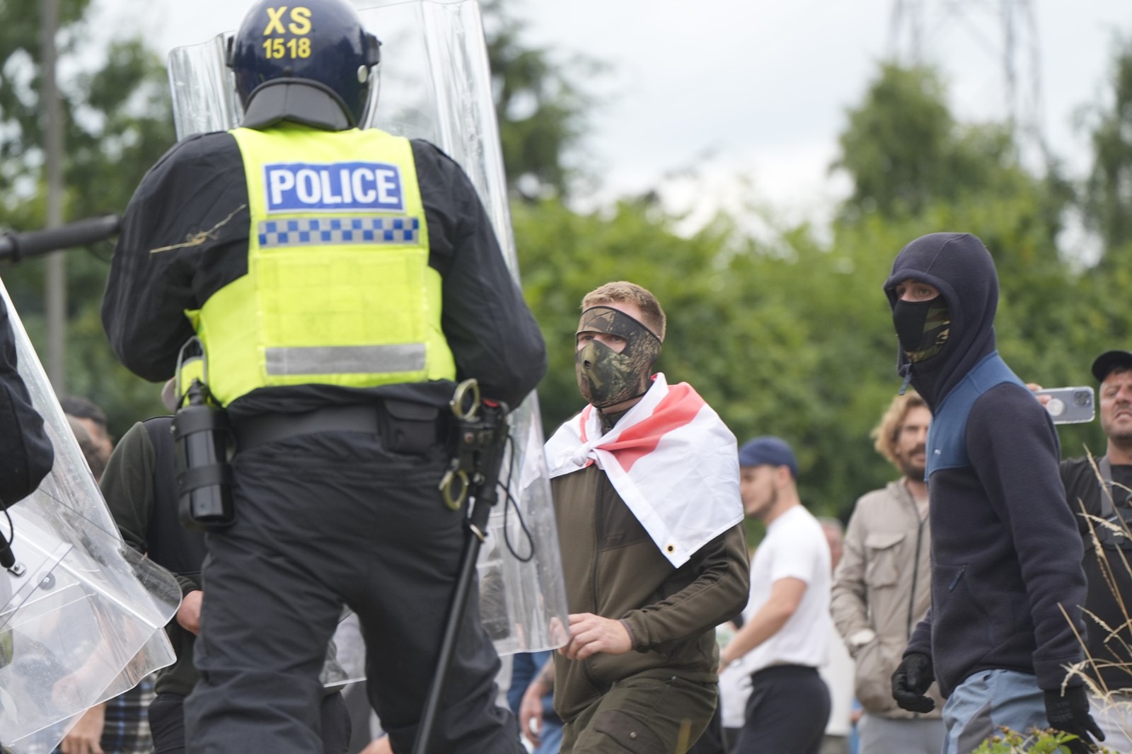 Police officers watch protesters during an anti-immigration demonstration outside the Holiday Inn Express in Rotherham, South Yorkshire. Picture date: Sunday August 4, 2024.,Image: 895898276, License: Rights-managed, Restrictions: , Model Release: no, Credit line: Danny Lawson / PA Images / Profimedia