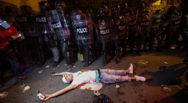 A protester lies on the ground in front of riot police during a rally against a controversial "foreign influence" bill, which Brussels warns would undermine Georgia's European aspirations, outside the Georgian parliament in Tbilisi on April 30, 2024.,Image: 869193775, License: Rights-managed, Restrictions: , Model Release: no, Credit line: Giorgi ARJEVANIDZE / AFP / Profimedia