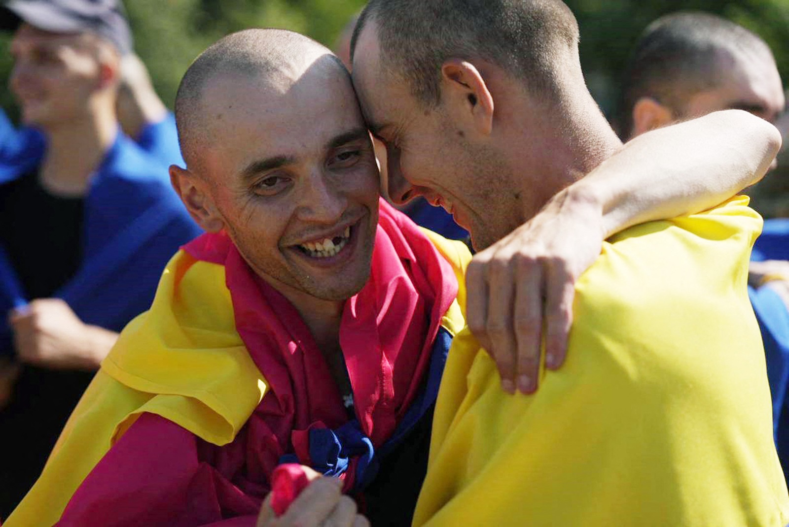 This undated handout photograph released by Ukrainian Presidential Press Service on August 24, 2024, shows Ukrainian prisoners of war wearing the state flags reacting after their exchange.  115 Ukrainian servicemen of the National Guard, the Armed Forces, the Naval Forces, and State Border Service were returned to Ukraine.,Image: 901198942, License: Rights-managed, Restrictions: RESTRICTED TO EDITORIAL USE - MANDATORY CREDIT "AFP PHOTO / UKRAINIAN PRESIDENTIAL PRESS SERVICE" - NO MARKETING NO ADVERTISING CAMPAIGNS - DISTRIBUTED AS A SERVICE TO CLIENTS, ***
HANDOUT image or SOCIAL MEDIA IMAGE or FILMSTILL for EDITORIAL USE ONLY! * Please note: Fees charged by Profimedia are for the Profimedia's services only, and do not, nor are they intended to, convey to the user any ownership of Copyright or License in the material. Profimedia does not claim any ownership including but not limited to Copyright or License in the attached material. By publishing this material you (the user) expressly agree to indemnify and to hold Profimedia and its directors, shareholders and employees harmless from any loss, claims, damages, demands, expenses (including legal fees), or any causes of action or allegation against Profimedia arising out of or connected in any way with publication of the material. Profimedia does not claim any copyright or license in the attached materials. Any downloading fees charged by Profimedia are for Profimedia's services only. * Handling Fee Only 
***, Model Release: no, Credit line: Handout / AFP / Profimedia