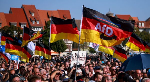 epa11575677 Supporters of far-right Alternative for Germany (AfD) party await the speech of faction chairman in the regional parliament of Thuringia Bjoern Hoecke, top candidate for the upcoming 2024 Thuringia state election during the final election campaign rally in Erfurt, Germany, 31 August 2024. Thuringia state election, voting for the regional parliament 'Landtag', will be held on 01 September 2024.  EPA/CLEMENS BILAN