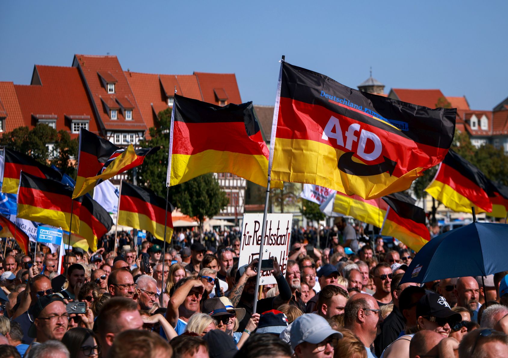 epa11575677 Supporters of far-right Alternative for Germany (AfD) party await the speech of faction chairman in the regional parliament of Thuringia Bjoern Hoecke, top candidate for the upcoming 2024 Thuringia state election during the final election campaign rally in Erfurt, Germany, 31 August 2024. Thuringia state election, voting for the regional parliament 'Landtag', will be held on 01 September 2024.  EPA/CLEMENS BILAN